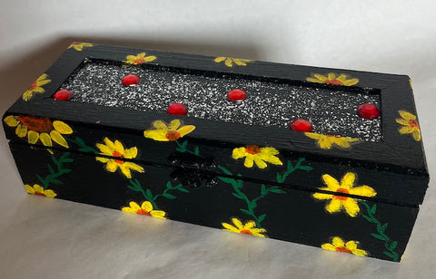 black wood box with red gems