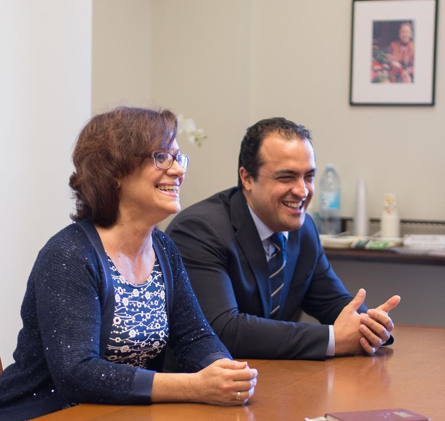Zoraida Garcia Garro (left) and Saba Mazza, members of the Continental Board of Counsellors of Europe, laugh during their conversation with fellow Counsellors.