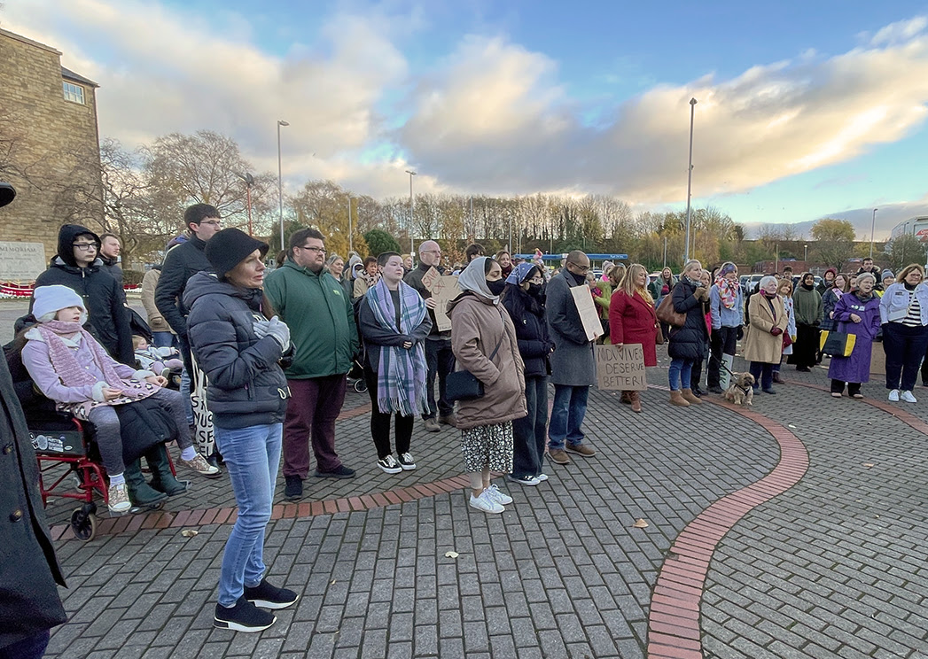 A photo showing a group of people at the vigil