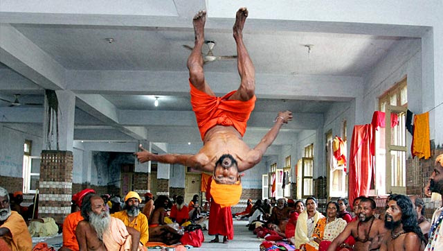 A Sadhu performs a somersault