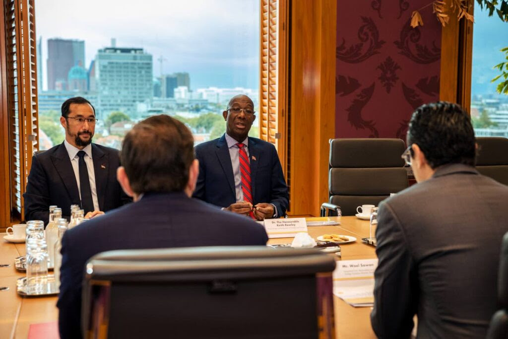 ENERGY TALKS: Prime Minister Dr Keith Rowley, background right, and Energy Minister Stuart Young. background left, speak with senior Shell executives at their offices in The Hague, Netherlands on Friday. PHOTO COURTESY OPM - Paco van Leeuwen