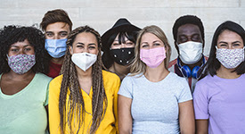group of people facing camera wearing masks