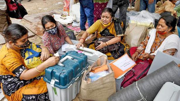 Last minute checks: Polling officials collect EVMs and other election materials before leaving for election duty ahead of the fifth phase of West Bengal Assembly elections, at Bidhannagar in Kolkata on Friday. PTI Ashok Bhaumik