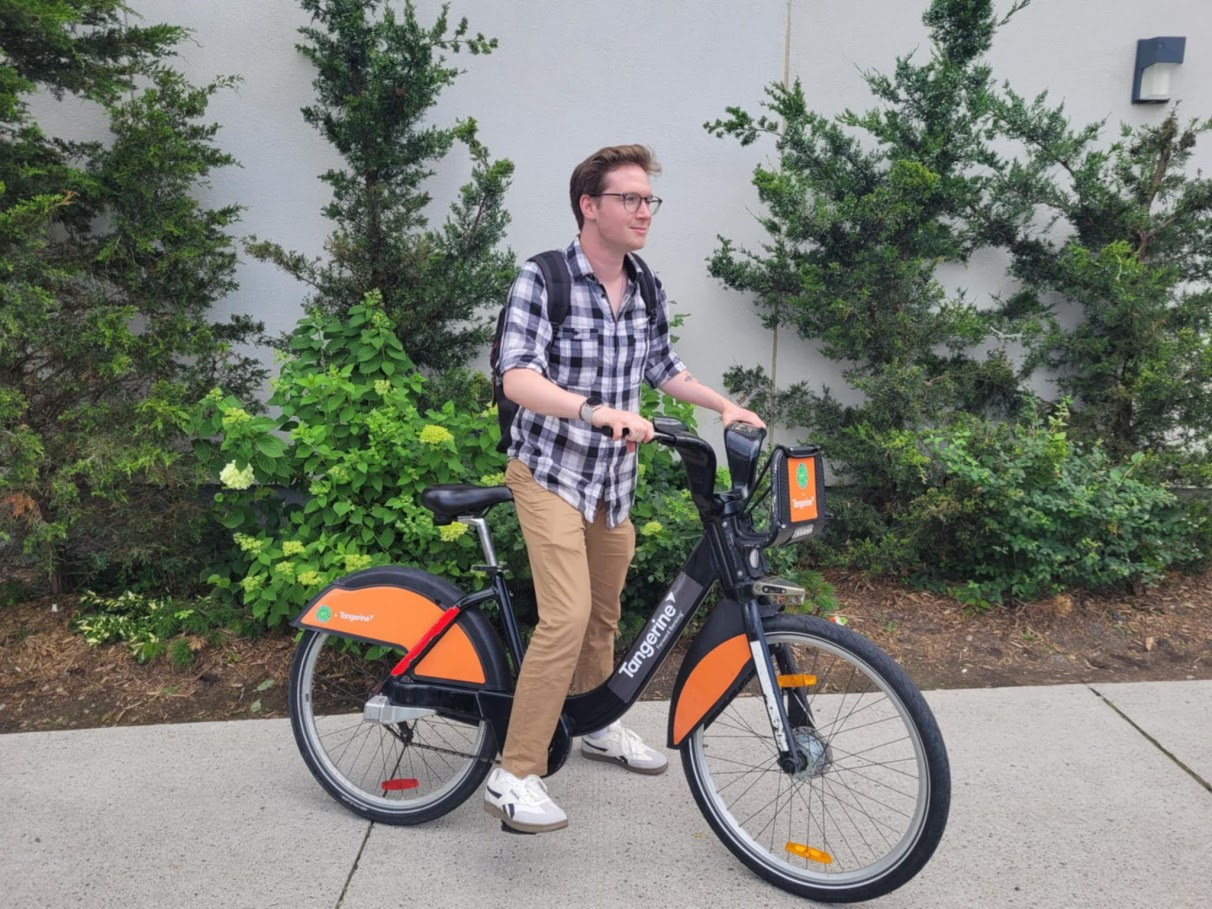 Guy on an orange and black bike
