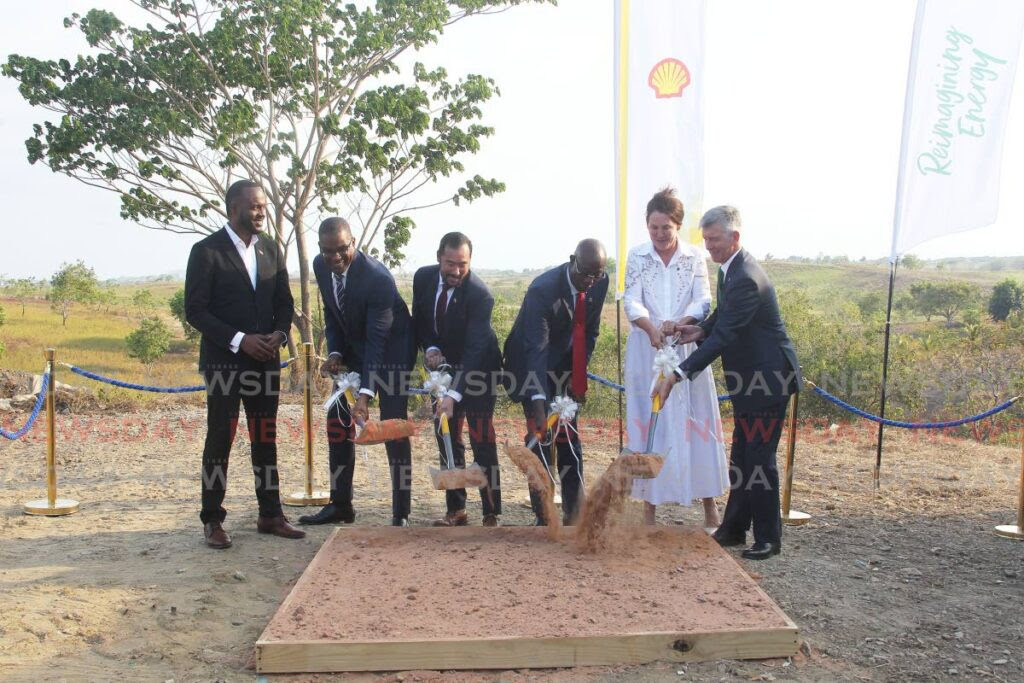 From left: Minister of Public Utilities Marvin Gonzales, Shell TT senior vice president Eugene Okpere, Energy Minister Stuart Young, Prime Minister Dr Keith Rowley, bp executive vice president Anja-Isabel Dotzenrath and bpTT president David Campbell turn the sod at the site of a new solar power plant at Brechin Castle, Couva, on Wednesday. - Lincoln Holder