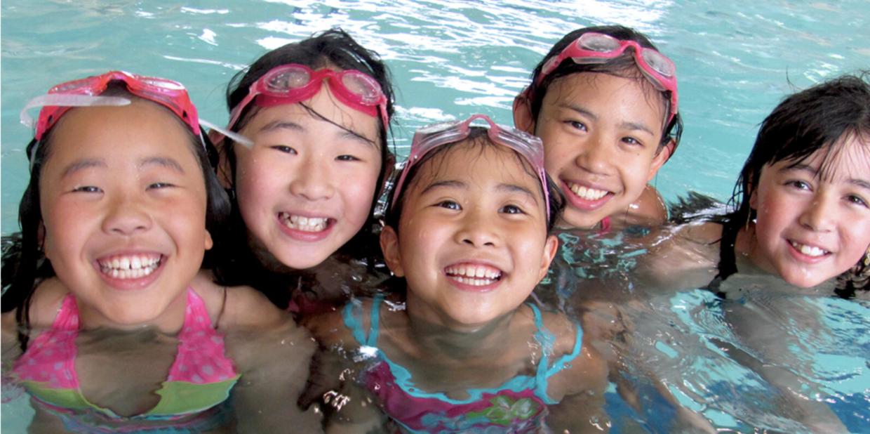 Five youth enjoying a Portland Parks & Recreation Indoor Pool
