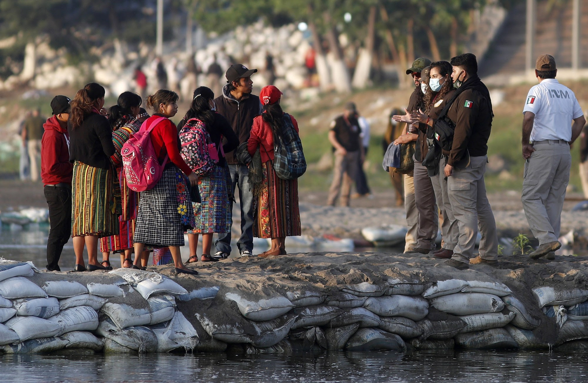 Mexican officials confronting immigrants at the US-Mexico border