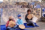 Children receive Matza at a Meir Panim Passover event.