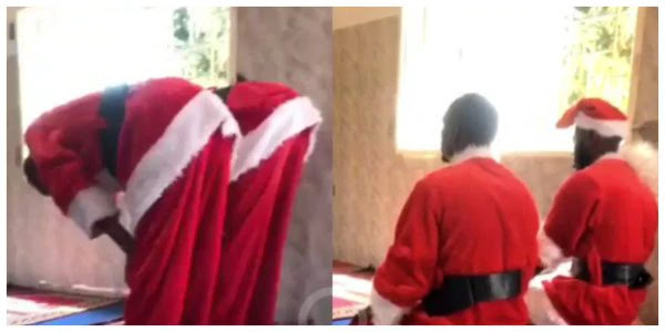 The Muslim men dressed in Santa costume praying inside mosque