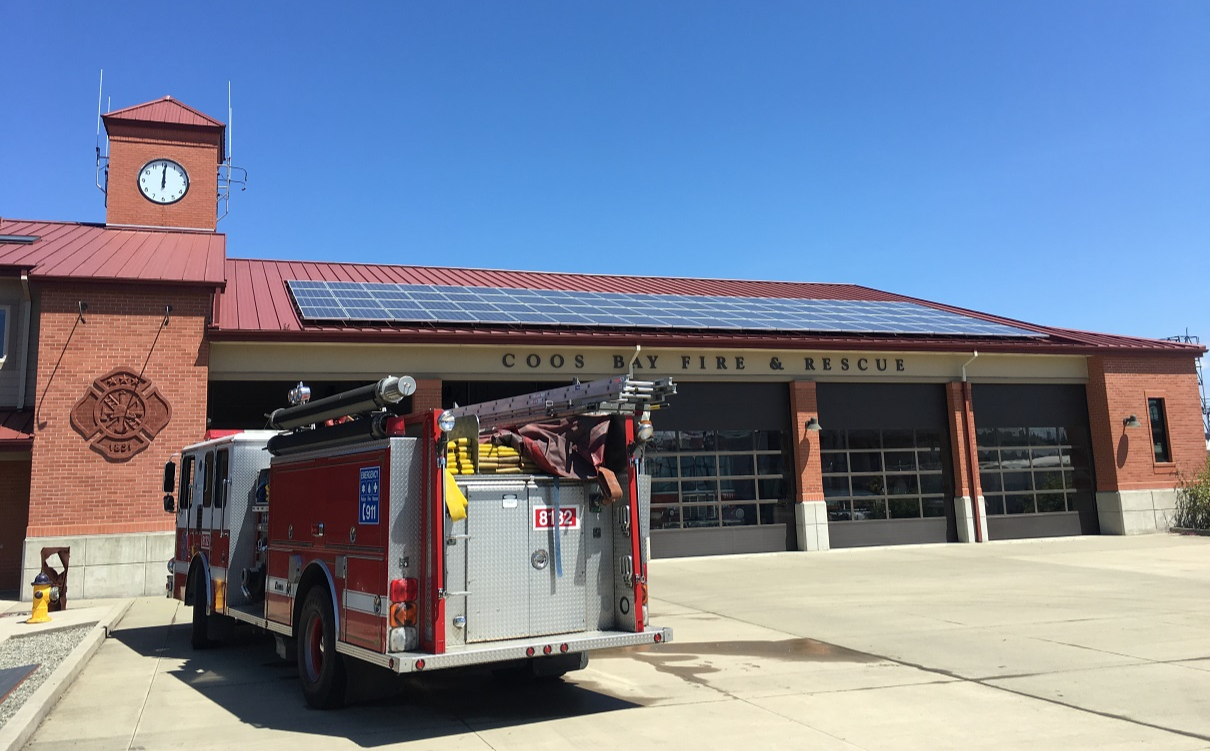Photo of solar panels on the roof of a fire station.