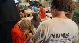 Image of NDMS personnel treating patient