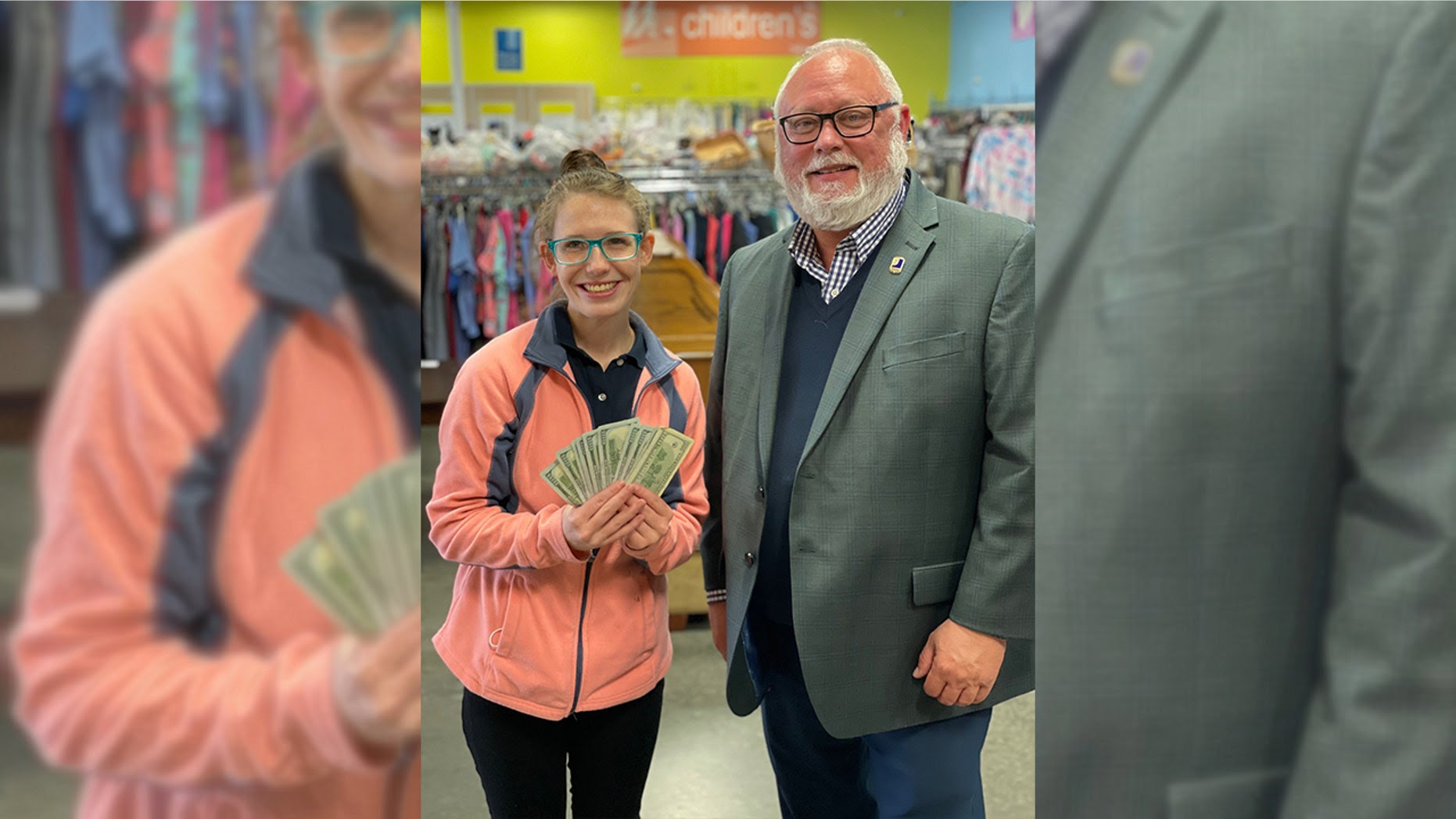 Frank Holland, the Goodwill VP of Donated Goods, presented Lessing with the cash reward. Frank Holland, the Goodwill VP of Donated Goods, presented Lessing with the cash reward.
