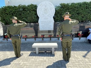 two ECOs salute memorial