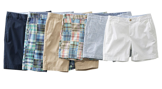 A line up of different color, fabric and length washed chino shorts.