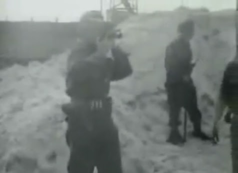 A                             cameraman filming SS men how they take dead                             bodies to the pit (15min. 12sec.)