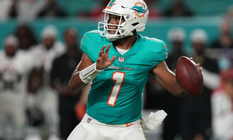 Tua Tagovailoa (#1) attempts a pass for Dolphins in 2021 NFL preseason game