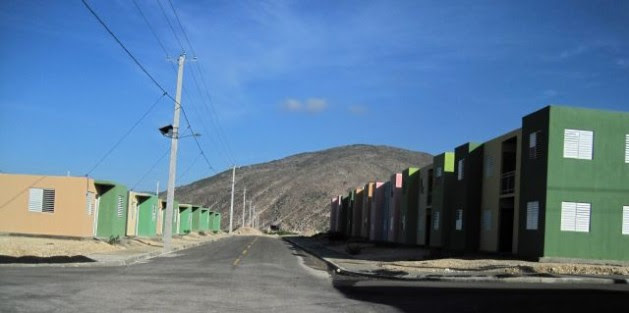 An intersection showing mostly empty homes at the heart of the Lumane Casimir Village near Morne à Cabri on Sep. 19, 2013. Credit: HGW/Marc Schindler Saint-Val