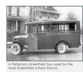 A Patterson-Greenfield bus printed with the words 'Greenfield School District'.