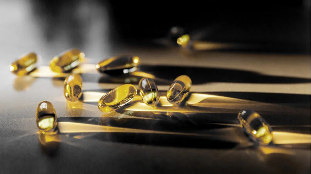 Vitamin D supplements scattered on a table