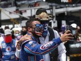 Team owner Richard Petty, right, poses for a selfie with driver Bubba Wallace prior to the start of the NASCAR Cup Series at the Talladega Superspeedway in Talladega, Ala., Monday, June 22, 2020. (AP Photo/John Bazemore)