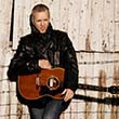 Folk Fest JJ Grey with his guitar.