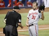 Washington Nationals starting pitcher Max Scherzer (31) is check for foreign substances by an umpire following the first inning of a baseball game against the Miami Marlins, Sunday, June 27, 2021, in Miami. (AP Photo/Rhona Wise) **FILE**