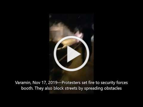 Iranian protesters torch security forces booth