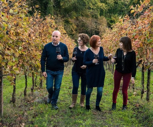 The Barbanera family - producers of Toscana Rosso da Uve Leggermente Appassite - walking through their vineyard. 