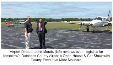 Airport Director John Mouris (left) reviews event logistics for tomorrow’s Dutchess County Airport’s Open House & Car Show with County Executive Marc 