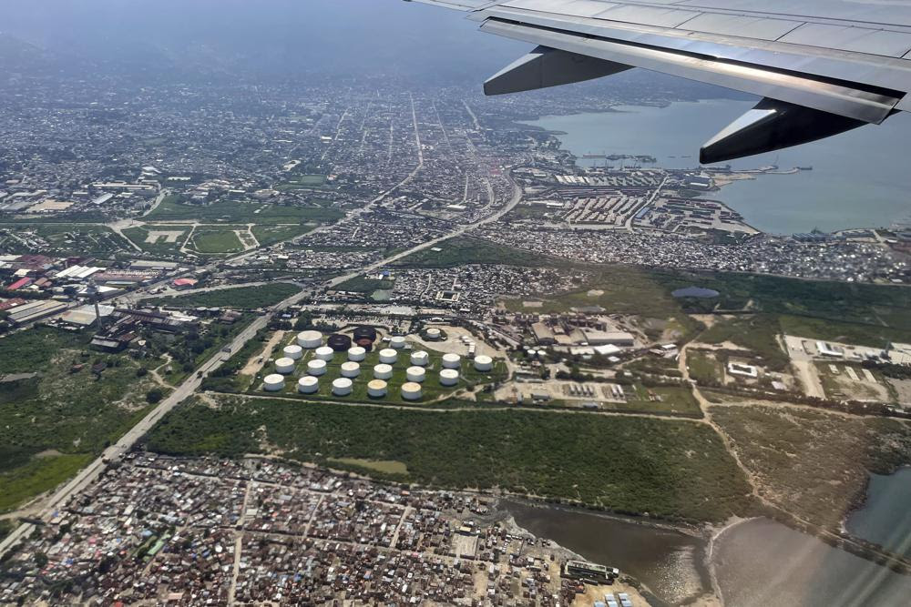 A fuel terminal is seen from a plane in Port-au-Prince, Haiti, Friday, Nov. 4, 2022. Haiti’s National Police has been fighting to remove a powerful gang that surrounded the key fuel terminal in Port-au-Prince for almost two months — though it's not immediately clear if the blockade has been fully lifted. (AP Photo/Ramon Espinosa