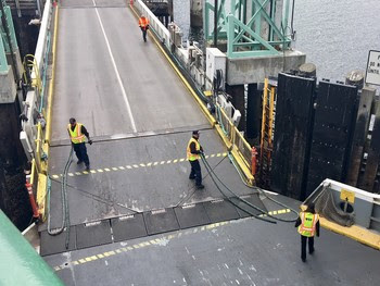 Photo of crewmembers working on a ferry