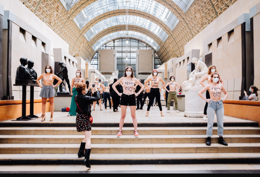 Feminists pose topless to protest after a woman was denied entry to museum over