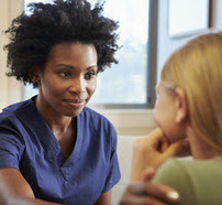 Clinician talking to patient