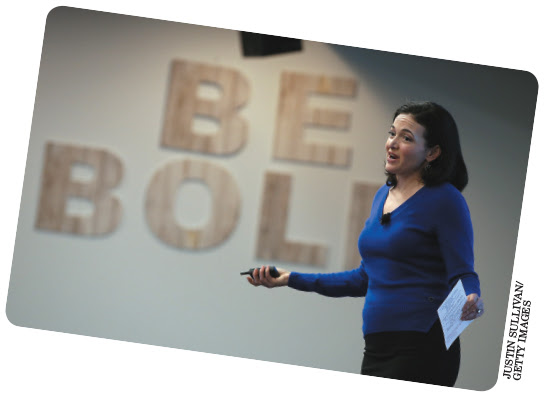 A photo shows Sheryl Sandberg addressing the audience.