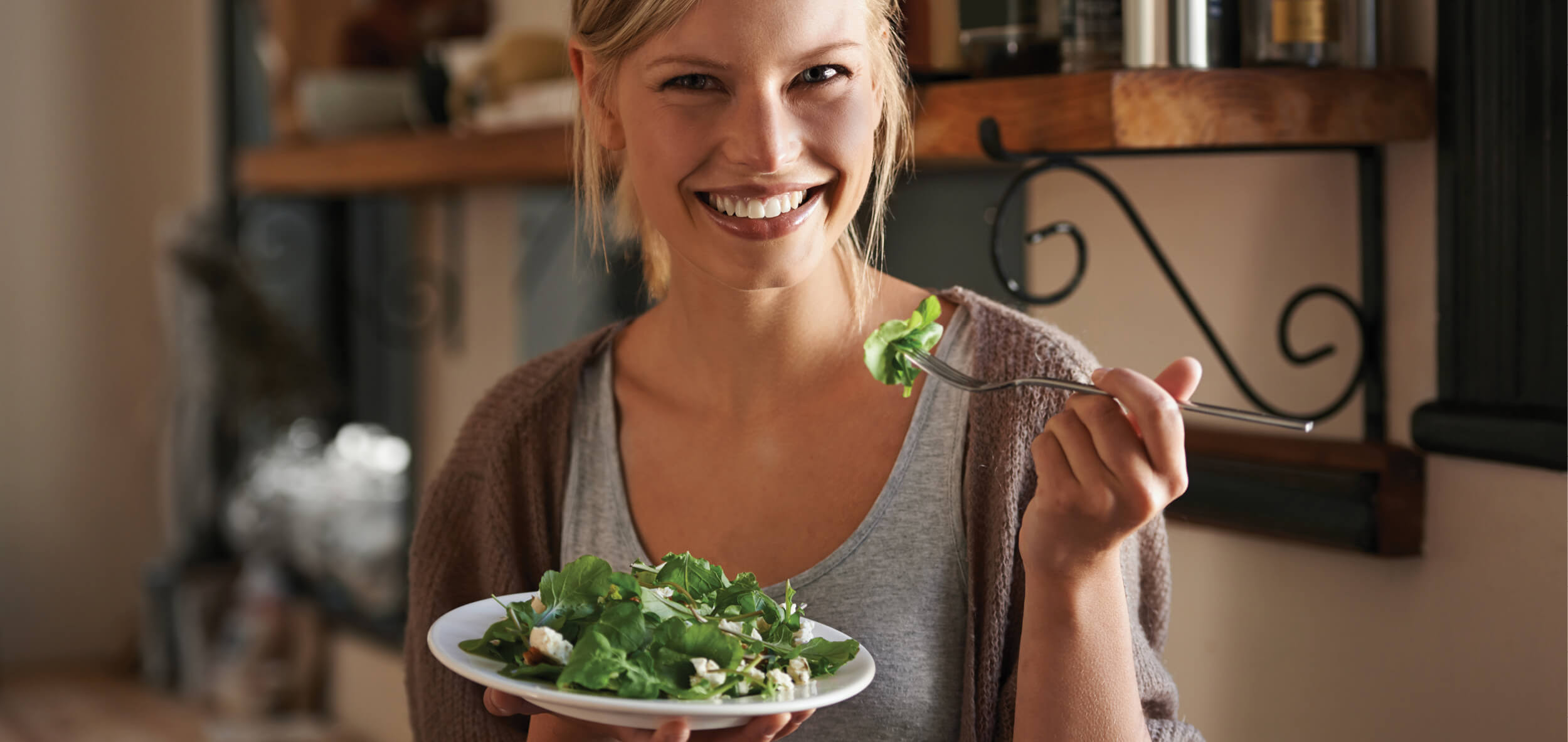 Woman eating salad