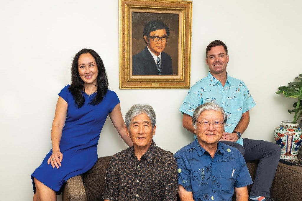 The team at the financial planning firm of Takagi and Takagi: Clockwise from top center is a painting of founder Douglas Takagi, Grant Jones, David Takagi, Verne Takagi and Taea Takagi-Jones. | Photo: Josiah Patterson