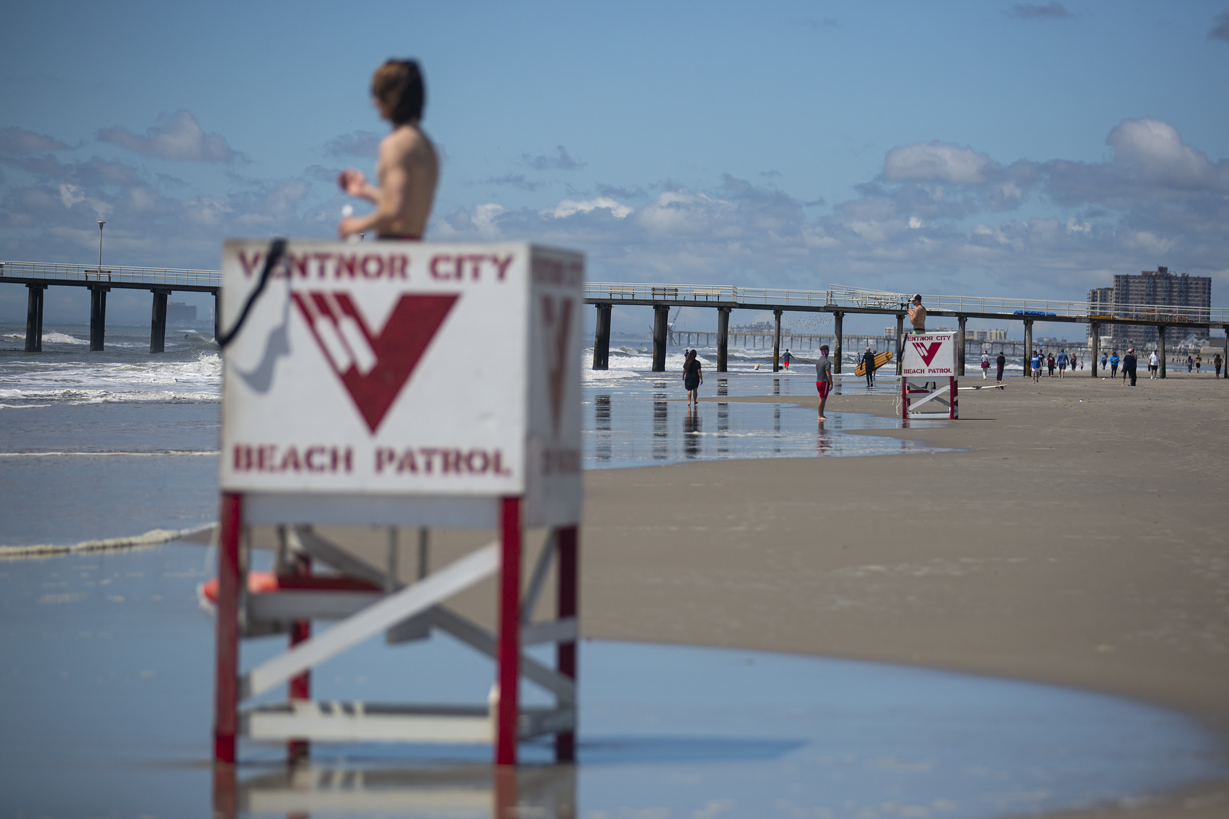 Lifeguards stand watch at Ventnor City Beach on Saturday, the first day they were back at work since the pandemic started.