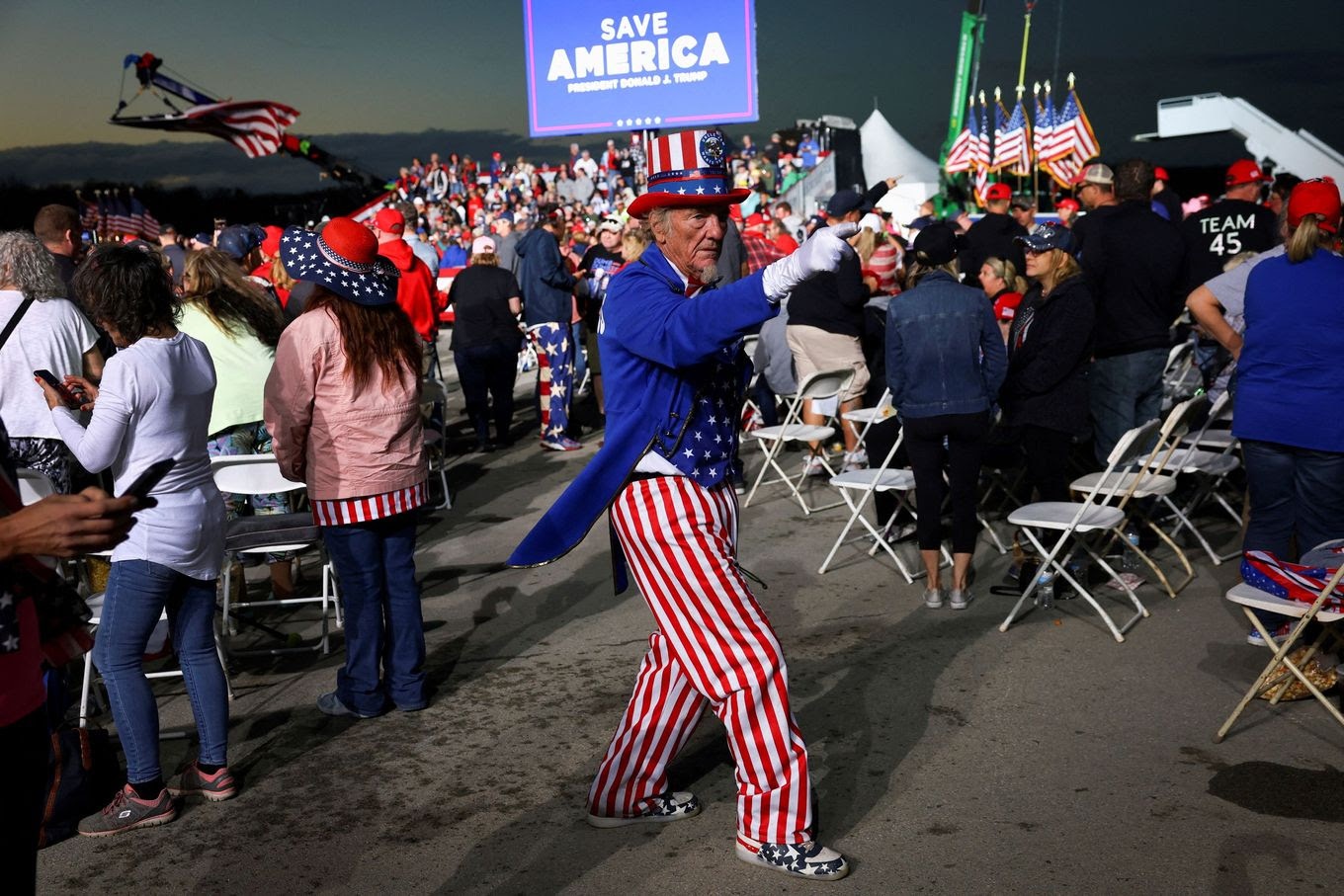 A person dressed as Uncle Sam attends a rally held by former president Donald Trump in support of Republican candidates in Latrobe, Pa., on Saturday. (Mike Segar/Reuters)