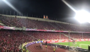 Iranians in packed soccer stadium chant “Reza Shah”