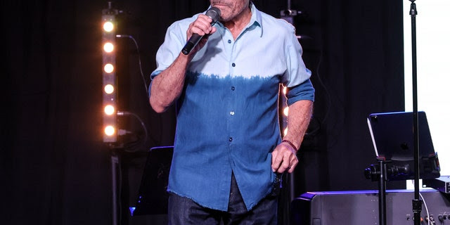 Lee Greenwood is shown performing on stage during a Music Memorial for Jeff Carson at Nashville Palace on May 10, 2022, in Nashville, Tenn.