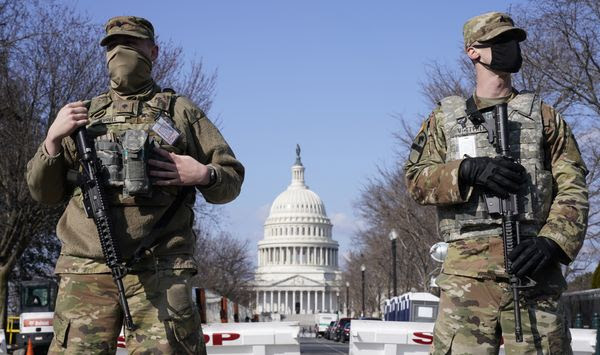 In this file photo, National Guard troops keep watch on the Capitol, Thursday, March 4, 2021, on Capitol Hill in Washington. (AP Photo/Jacquelyn Martin) ** FILE **