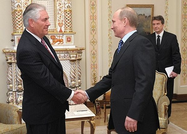 ExxonMobile Chairman and CEO Rex Tillerson meets with Russian Premier Vladimir Putin in 2012.