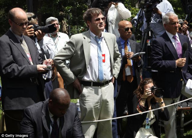 Immediately contentious: Neil Munro (C), the White House Correspondent for the Daily Caller, peppered Obama with unexpected questions during the announcement, during which the president hadn't planned to take questions at all