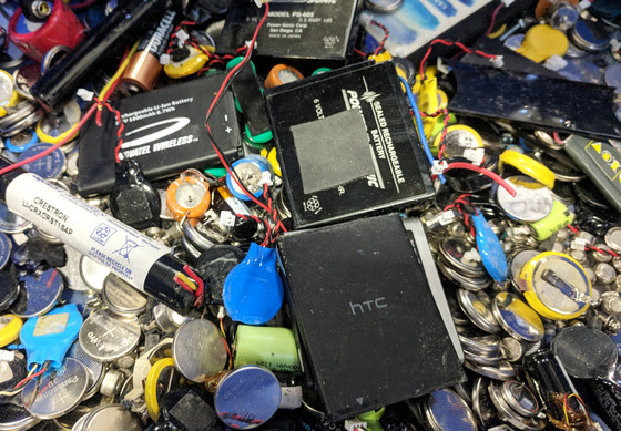 An assortment of batteries, including lithium-ion batteries that should be properly disposed of and not just thrown away.