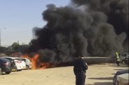Fireman putting out burning cars - Nov. 27, 2016