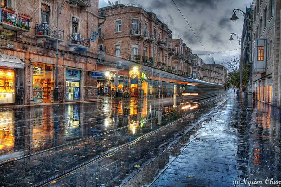 jerusalem light rail crossing jaffa street on a rainy day