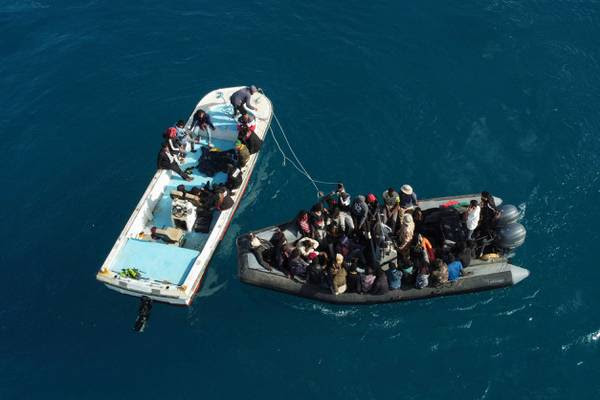 Boats of migrants entering a port in the Garabulli area, Libya. AFP