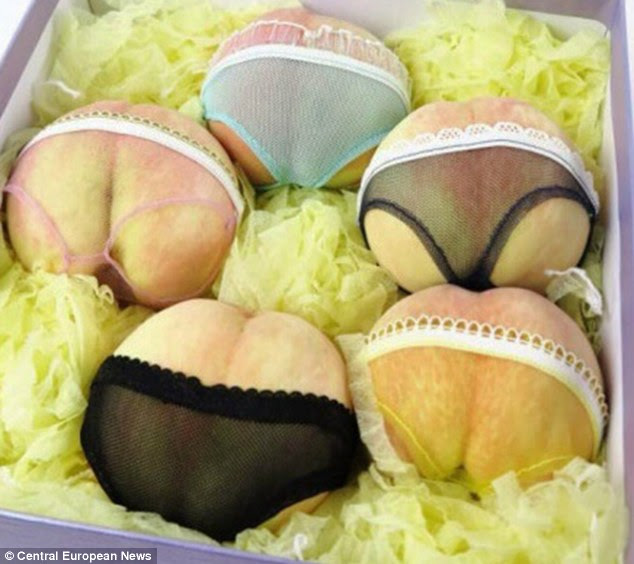 All laced up: Owner Yao Yuan says he came up with the novel idea to flog his fruit after discovering the similarities between peaches and women's bottoms