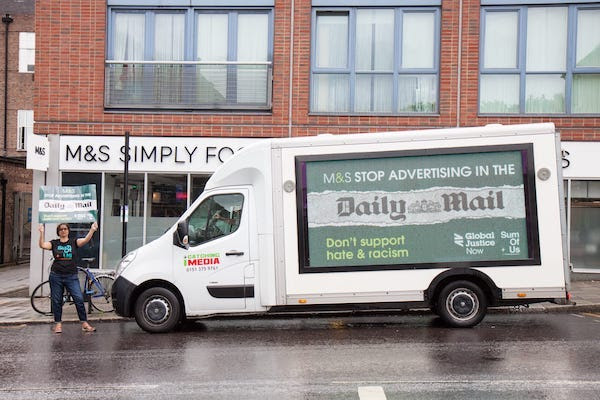 Mobile ad van calling on M&S to stop advertising in the Daily Mail outside an M&S store.
