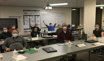 Photo of people wearing masks in a classroom